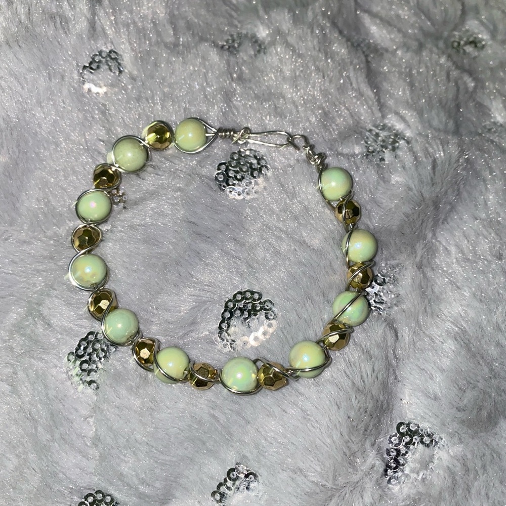 Beautiful green and yellow bead and dark brown goldish bead wired bracelet